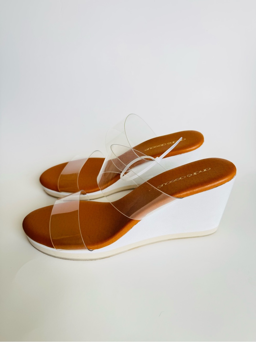 Andre Assous Clear Strap Wedge Sandals in Tan and White